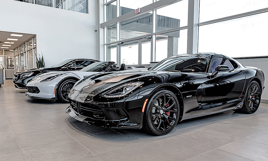 Highend usedcar dealer sells Teslas and customized trucks to fight